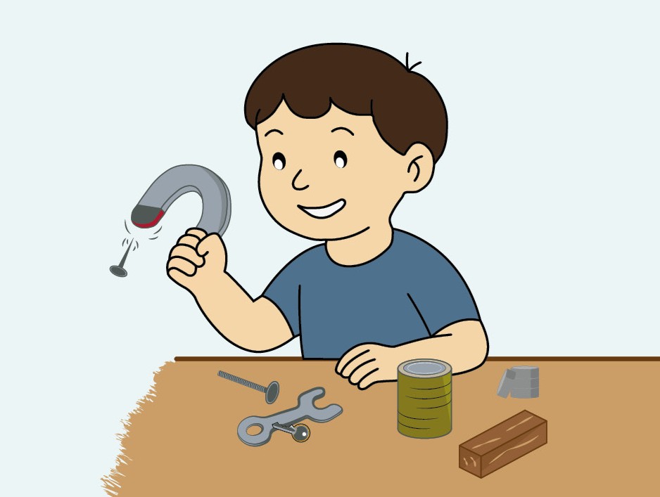 Junge mit Magnet und Gegenstände